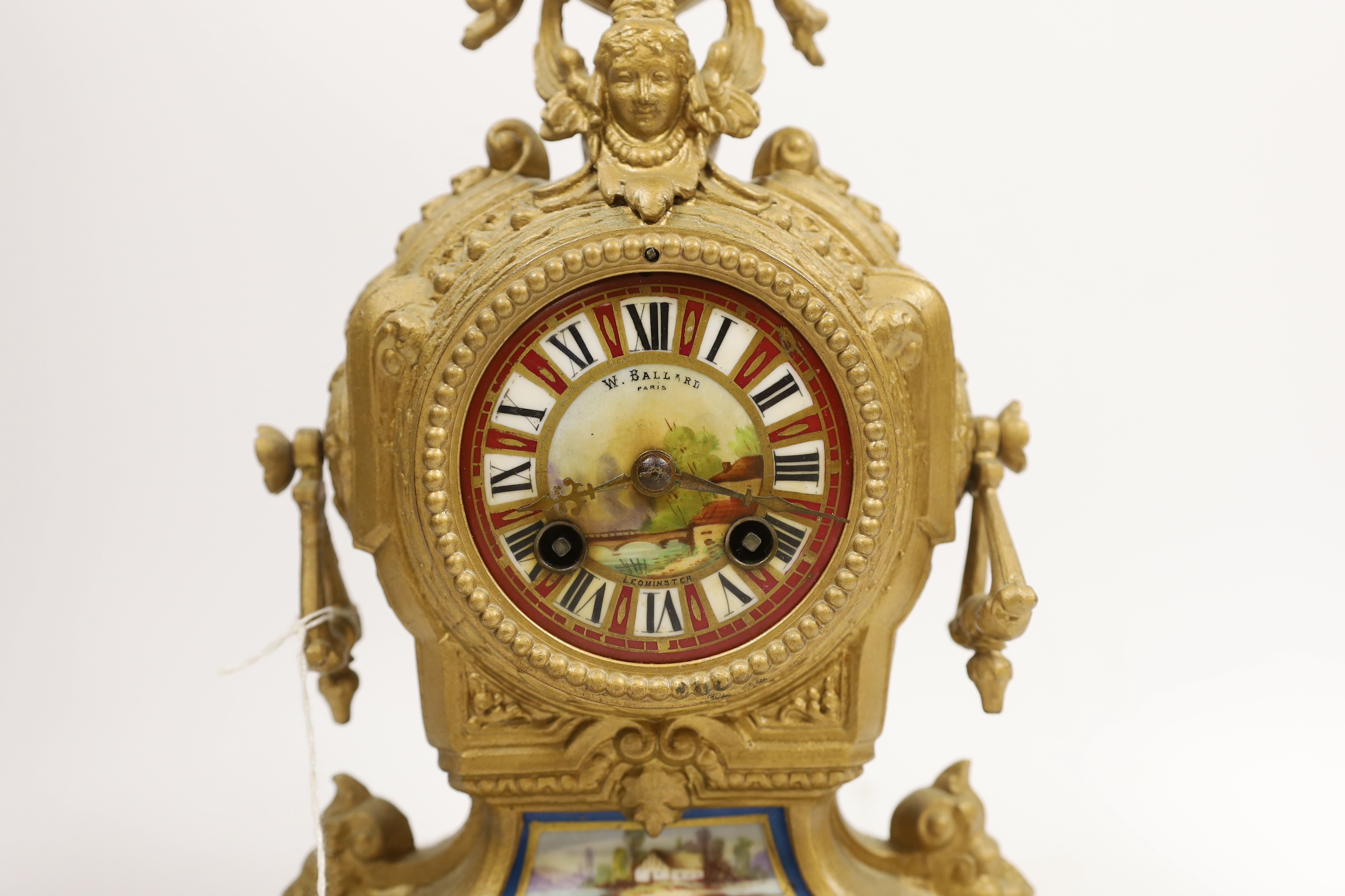 A French spelter mantel clock, 30cm high